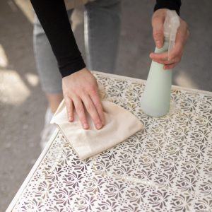 young-woman-disinfecting-before-opening